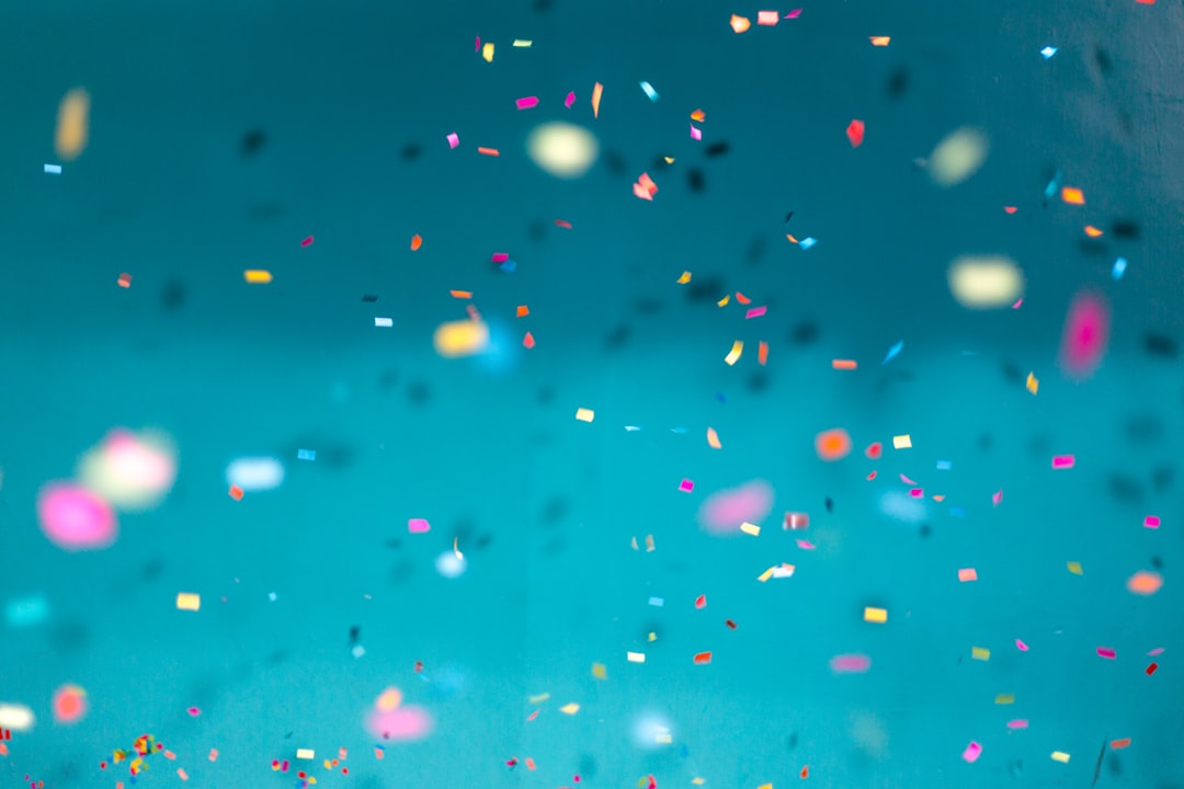 bright, colorful confetti on aqua background