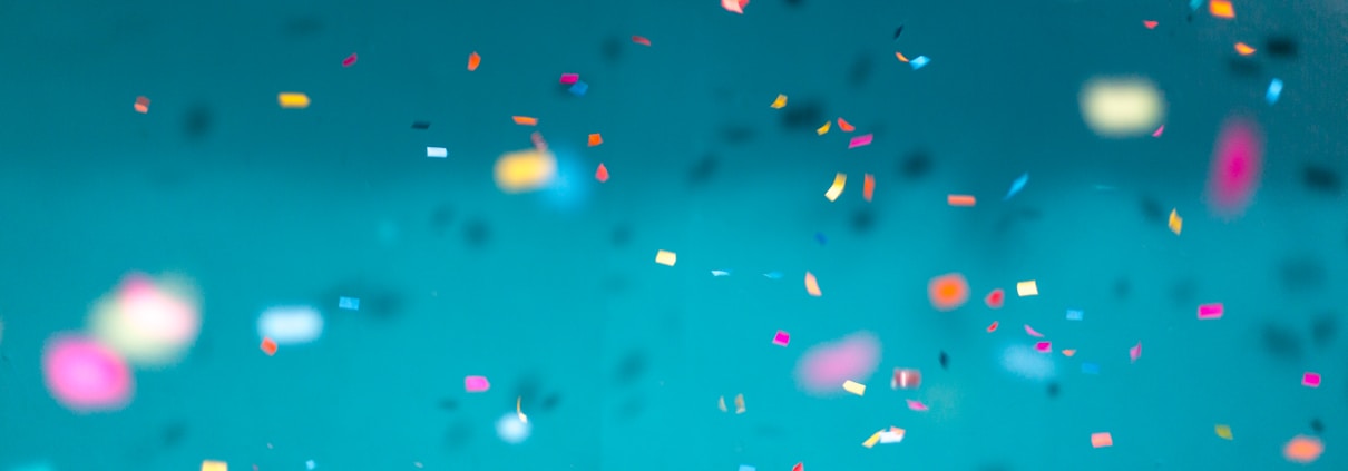 selective focus photography of multicolored confetti lot