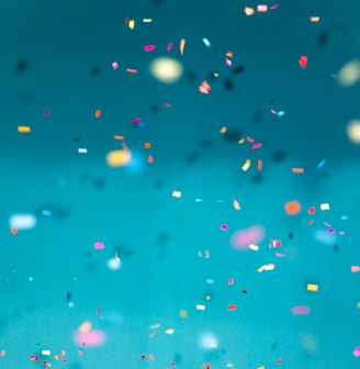 selective focus photography of multicolored confetti lot