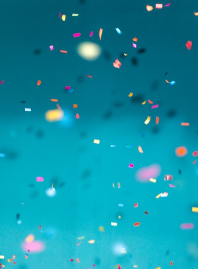 selective focus photography of multicolored confetti lot