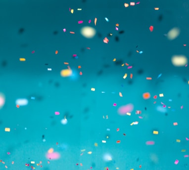 selective focus photography of multicolored confetti lot