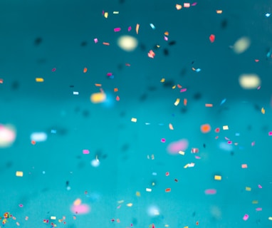 selective focus photography of multicolored confetti lot