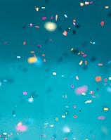 selective focus photography of multicolored confetti lot