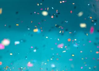 selective focus photography of multicolored confetti lot