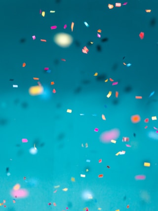 selective focus photography of multicolored confetti lot