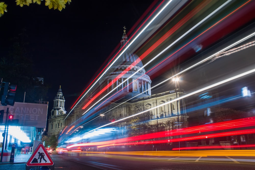 time lapse photography of road near concrete dome building