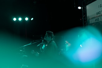 A person speaking into a microphone with music notes floating around.