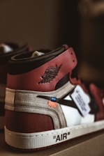 pair of red-and-white Air Jordan 1's