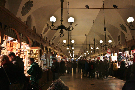 A bustling antique mall with cozy booths and friendly vendors chatting with visitors.