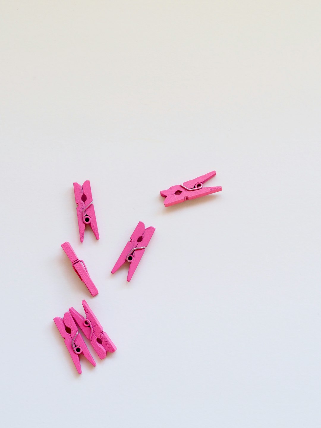 six pink clothes clips