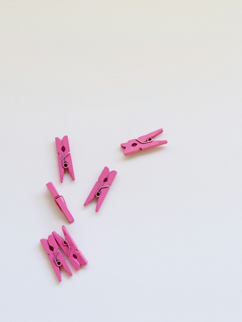 six pink clothes clips