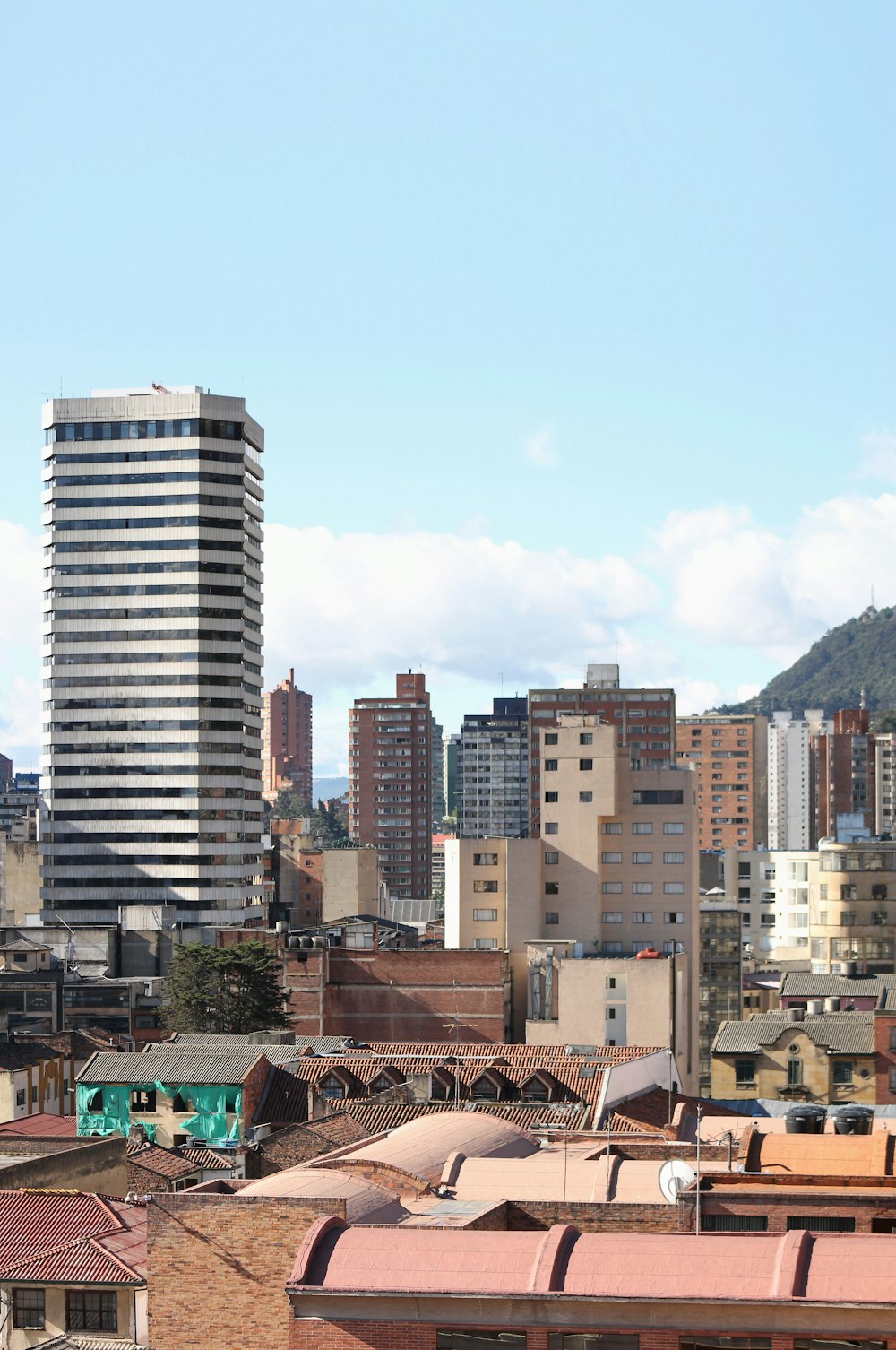 assorted-color buildings under blue skies at daytime