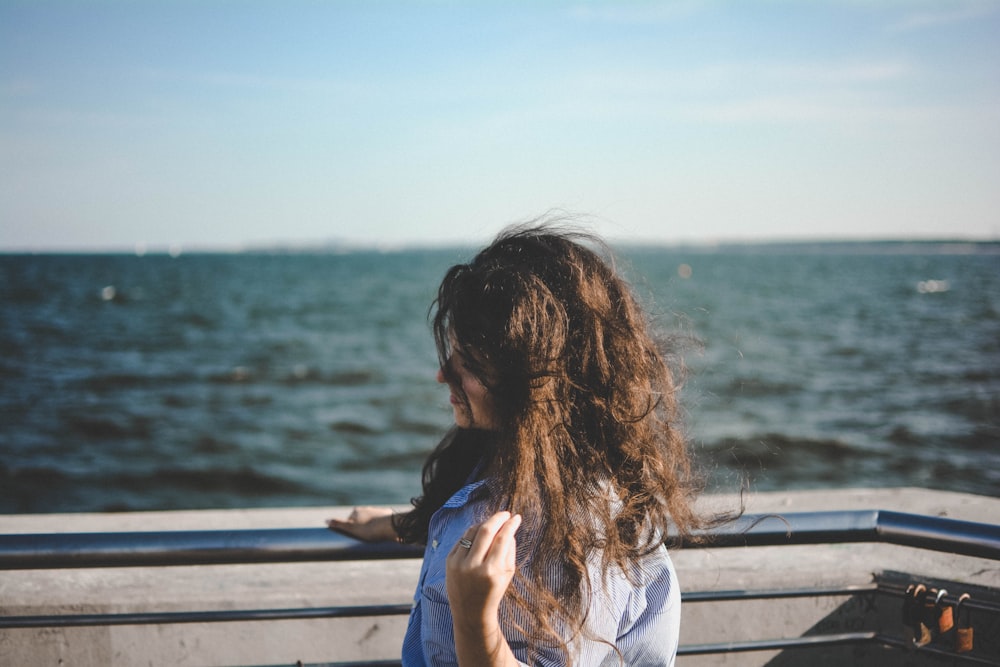 woman leaning on balcony