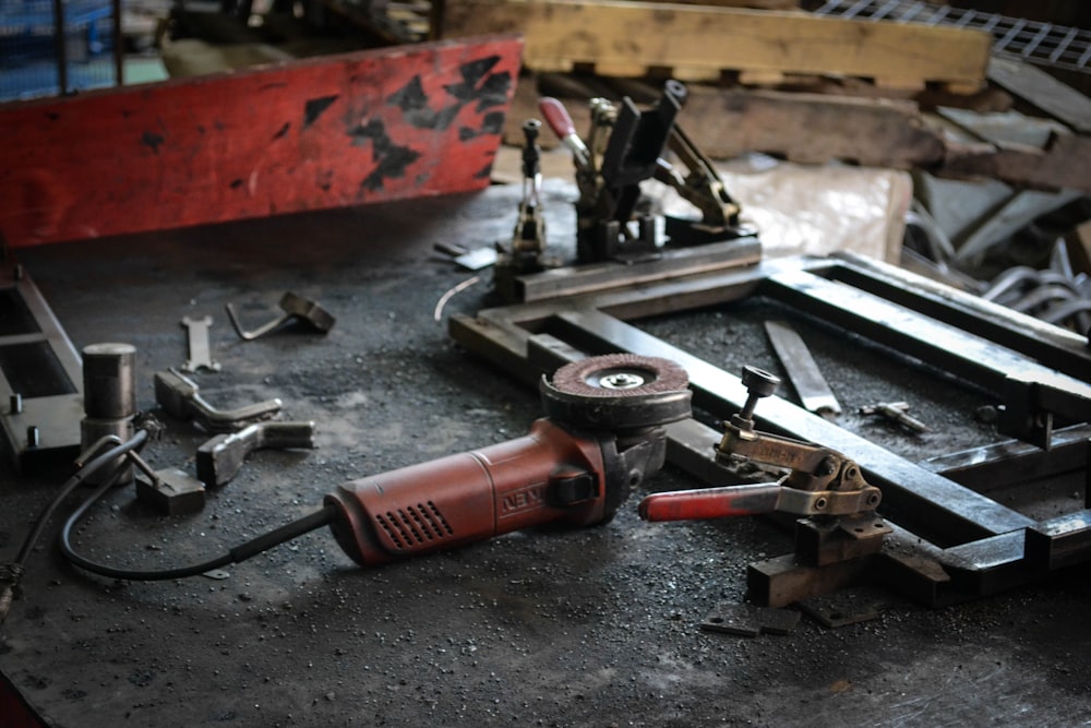 red and black corded angle grinder