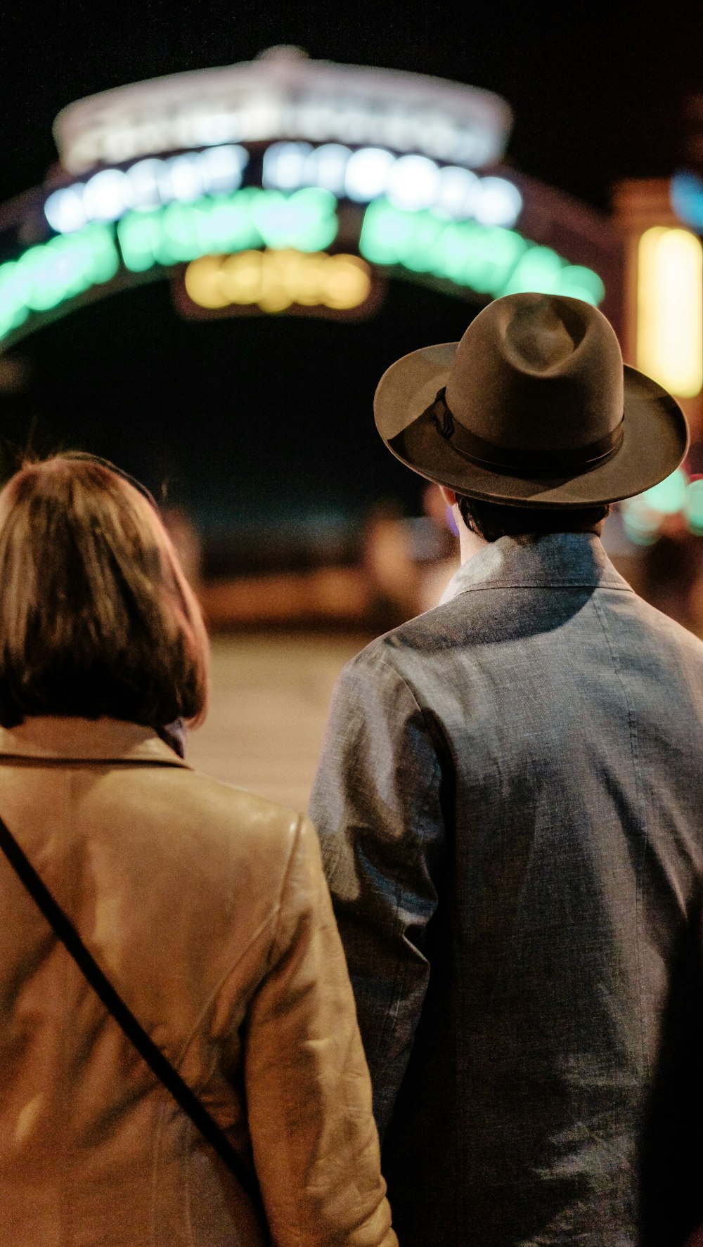 man and woman standing on street