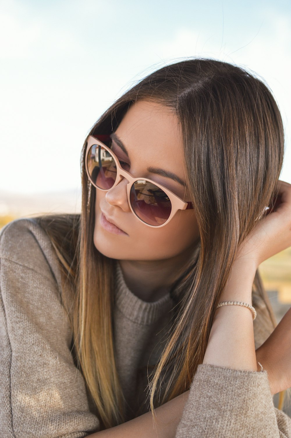 woman wearing gray sunglasses