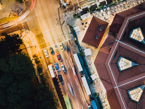 Wide angle view of a bustling urban intersection featuring multiple FOOH installations.