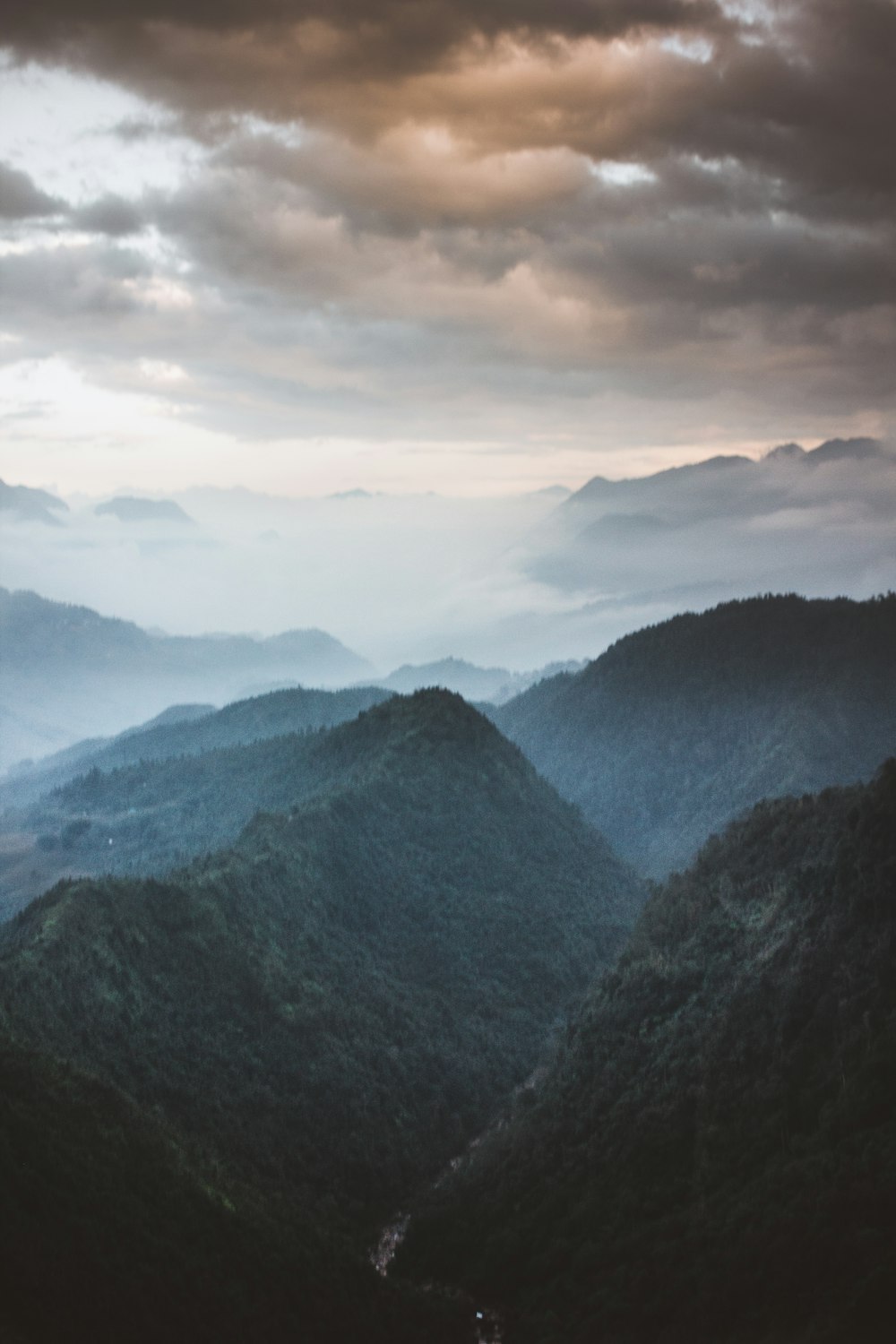 bird's-eye view photography of mountain valley with clouds