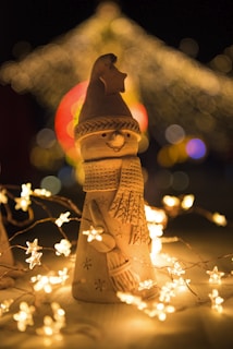 bokeh photography of snowman figurine