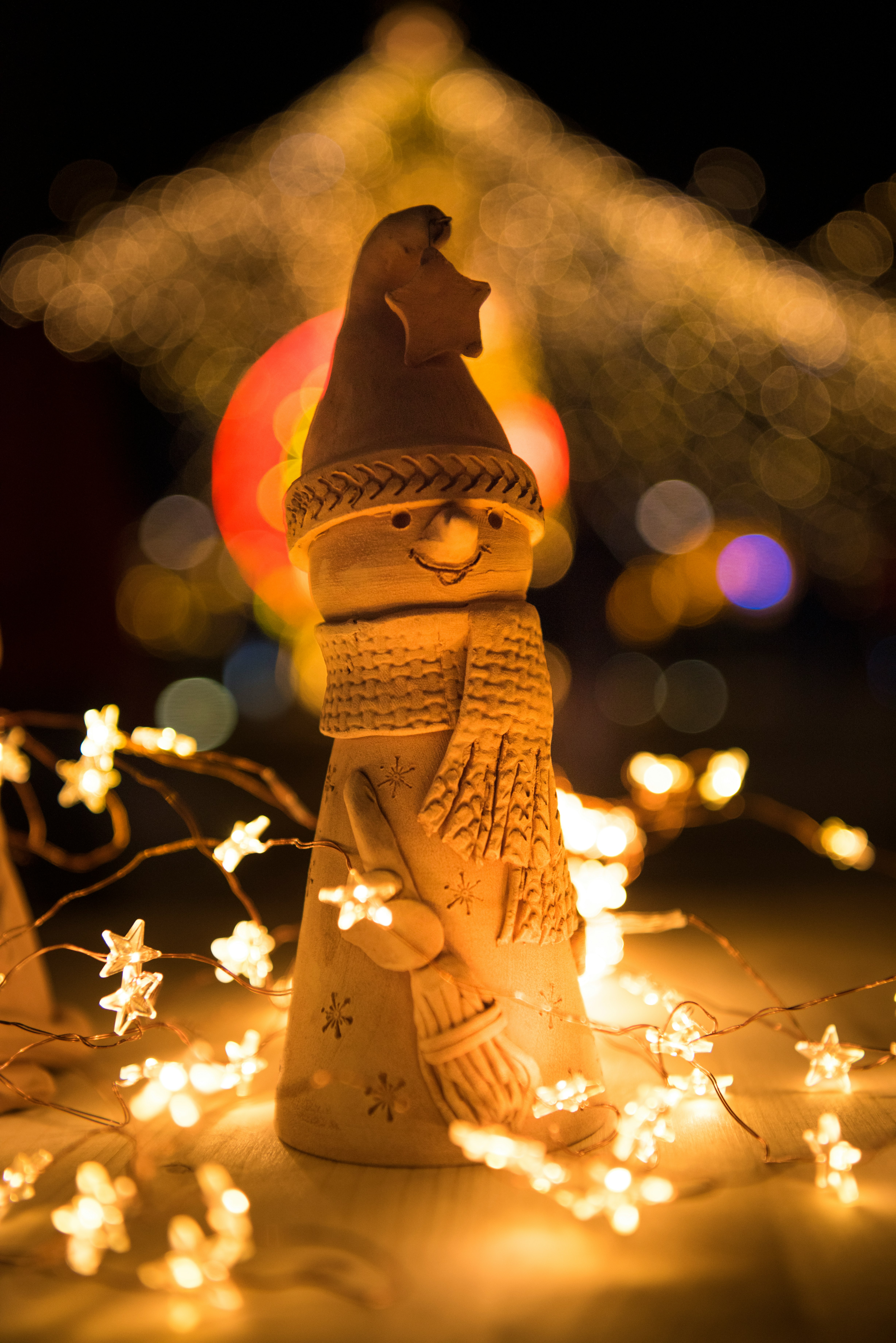 bokeh photography of snowman figurine