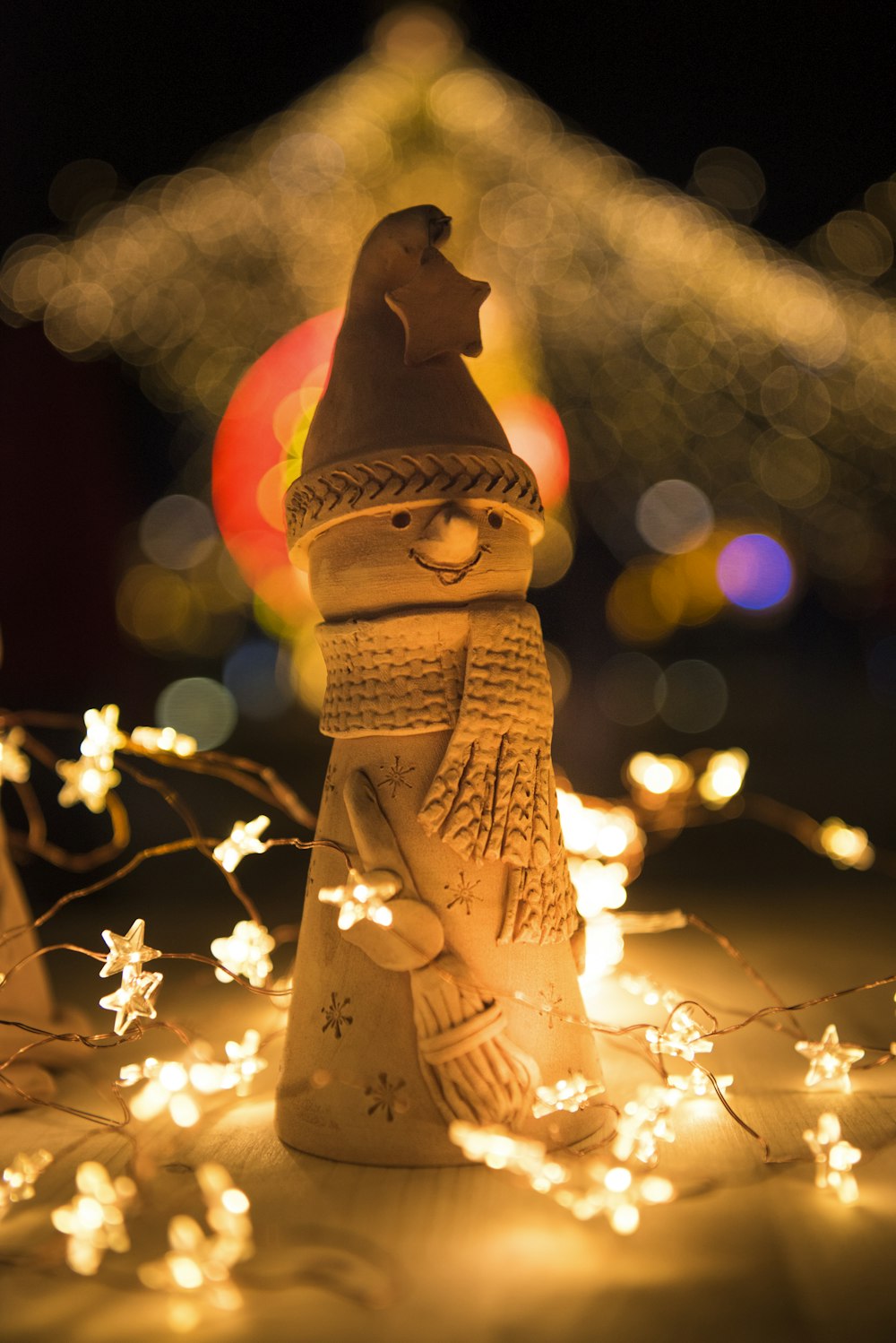 bokeh photography of snowman figurine