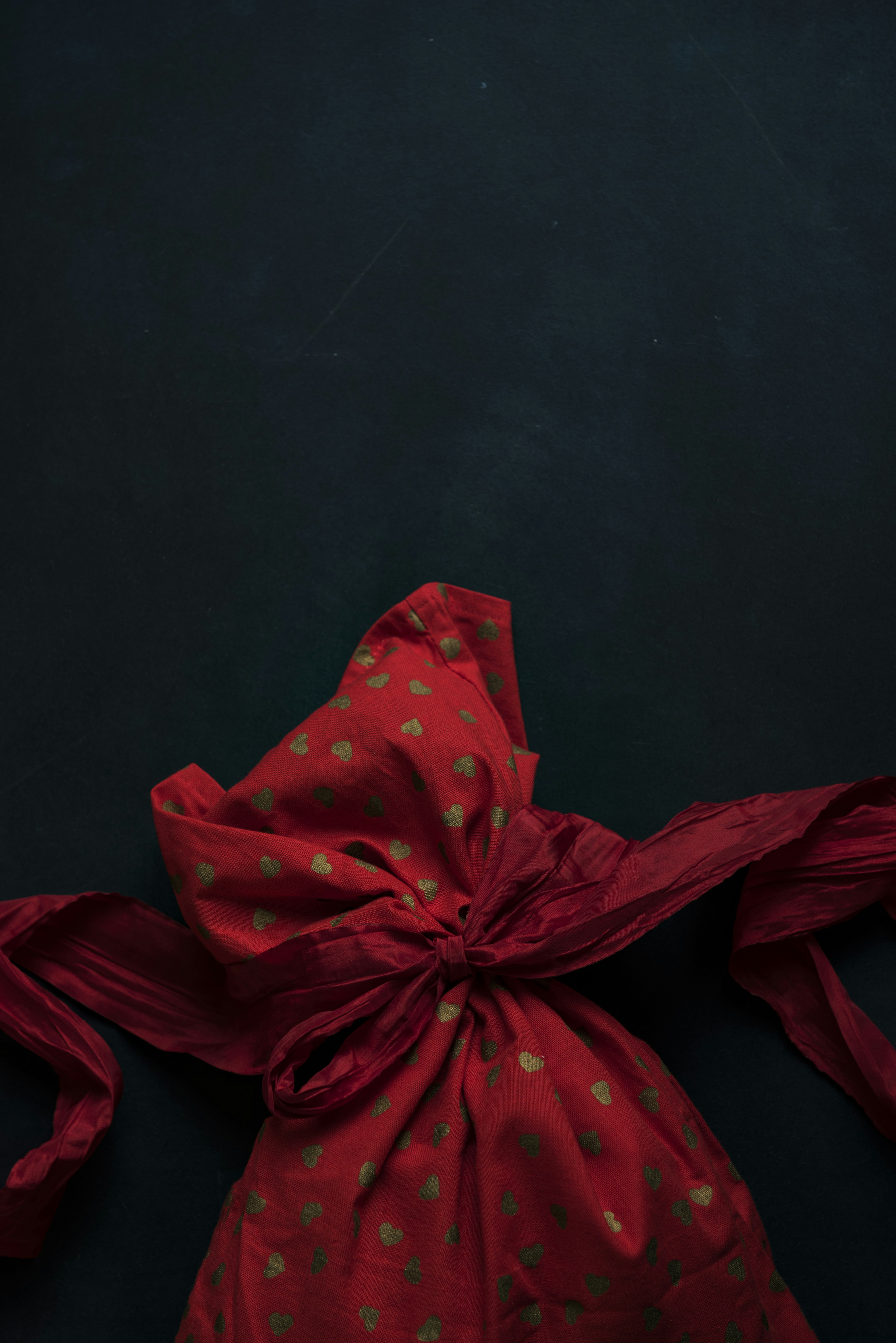 red and beige heart-printed cloth