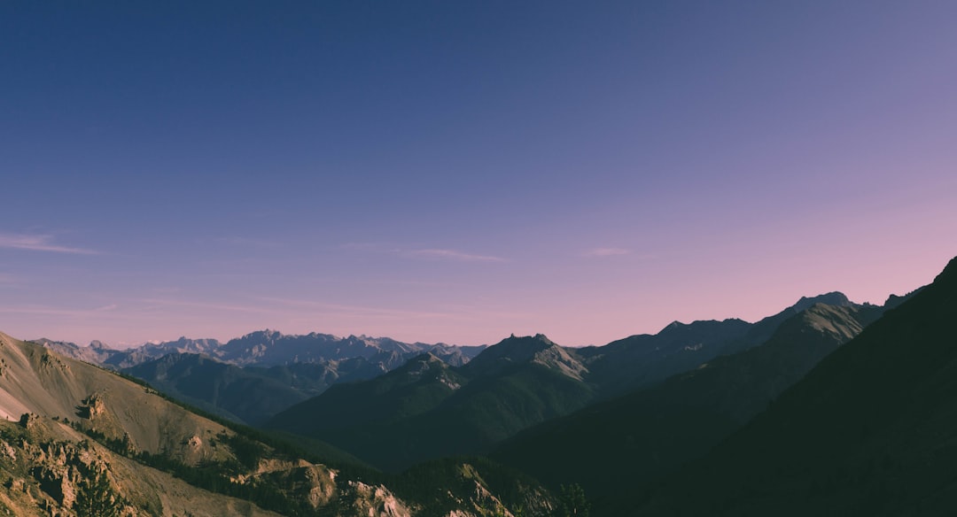 landscape photography of mountains under blue sky, Summits
