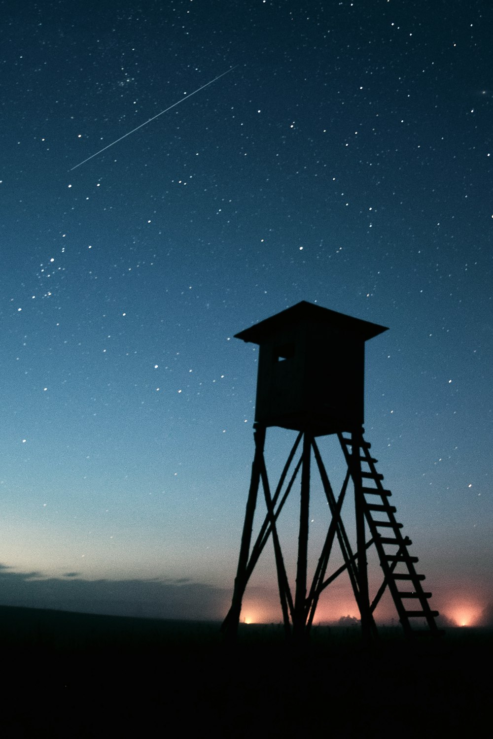 silhouette of shed during night