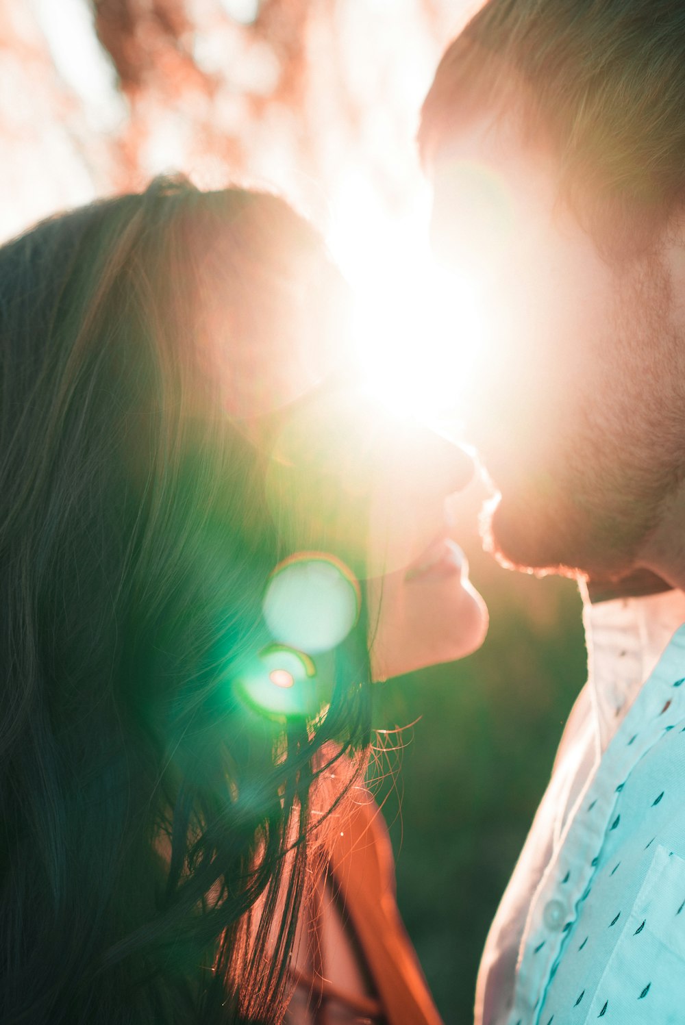 couple kissing during golden hour