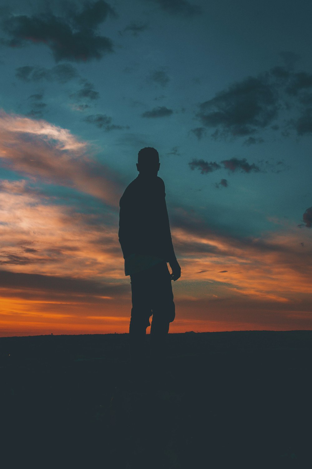 silhouette on man standing on ground