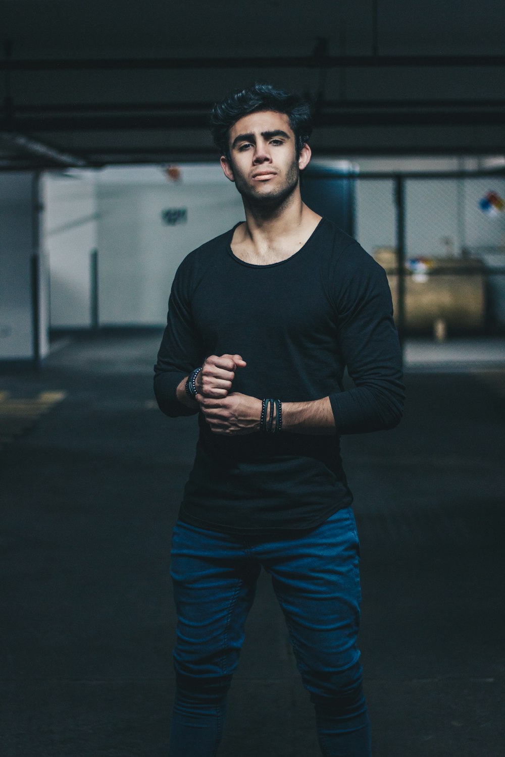 man wearing black crew-neck long-sleeved t-shirt