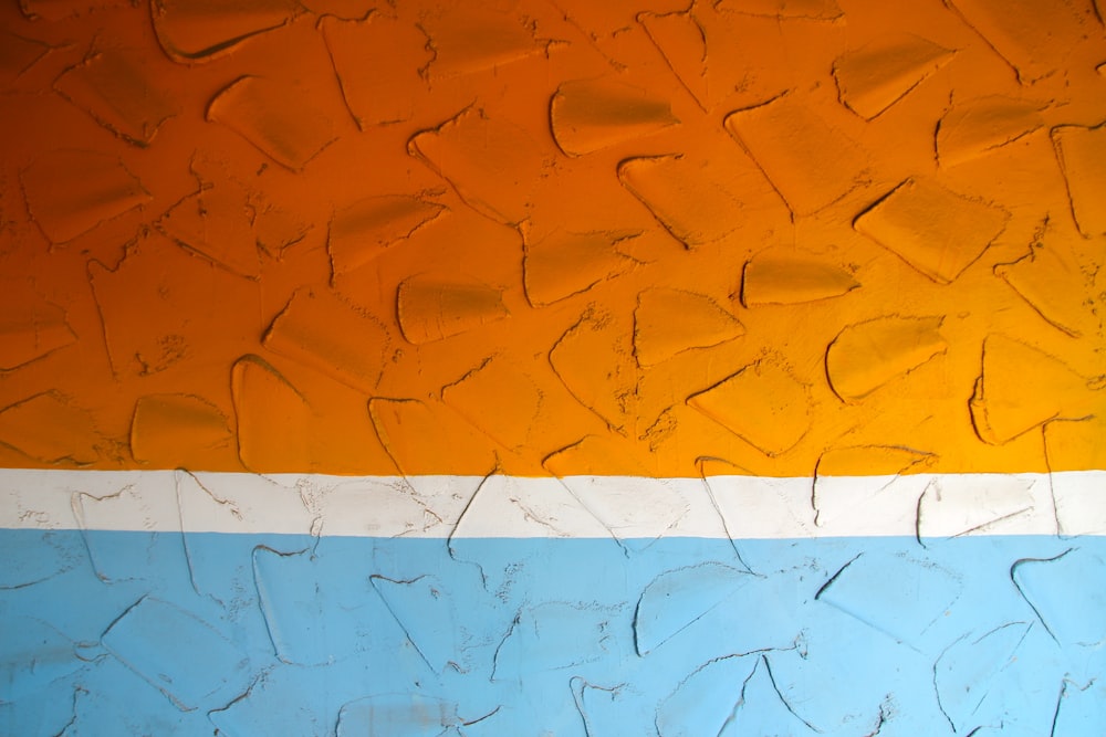 photo of orange, white, and blue artwork