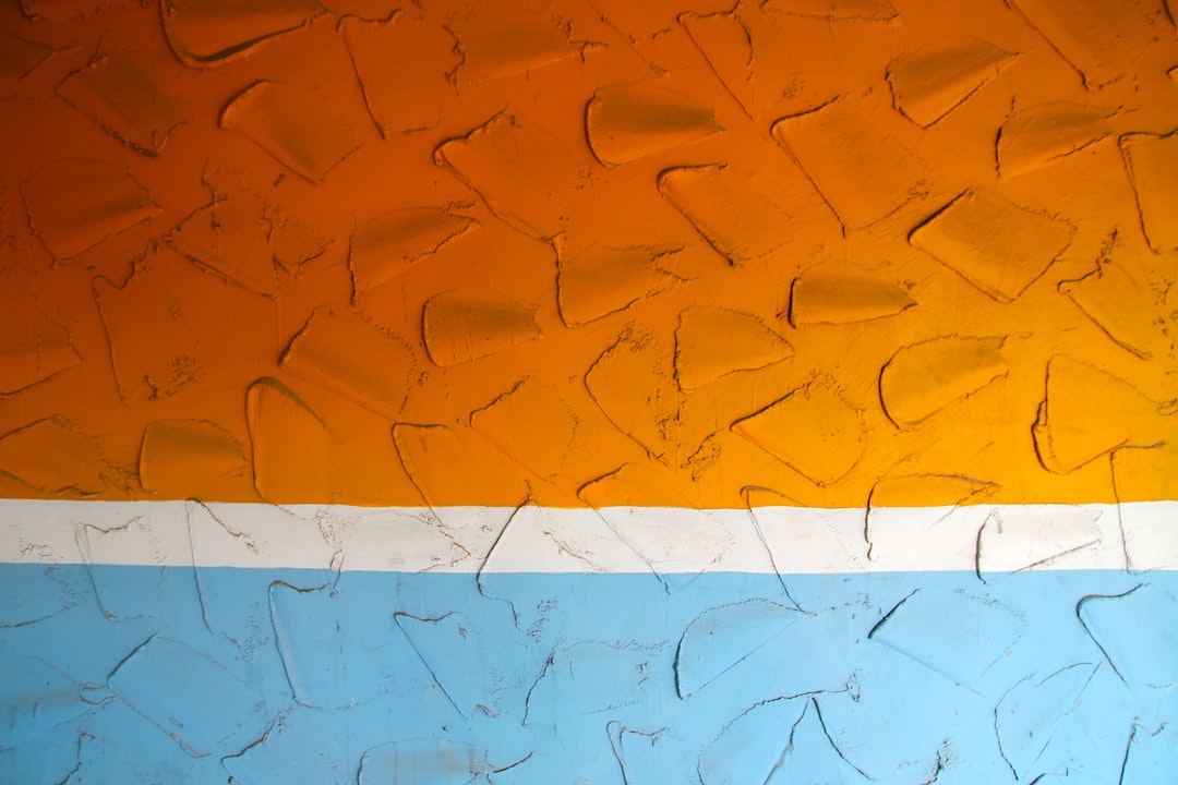 photo of orange, white, and blue artwork