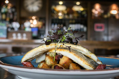 Fresh whole fish dish plated at a seafood-focused restaurant