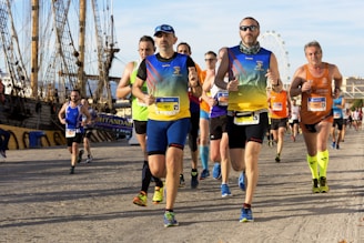 people running on gray soil near boat