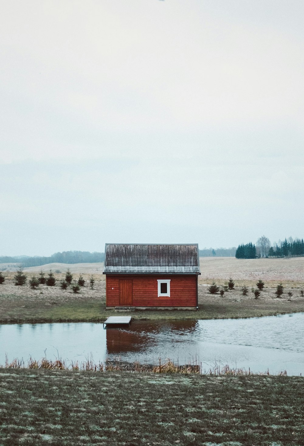 house at the center of pond