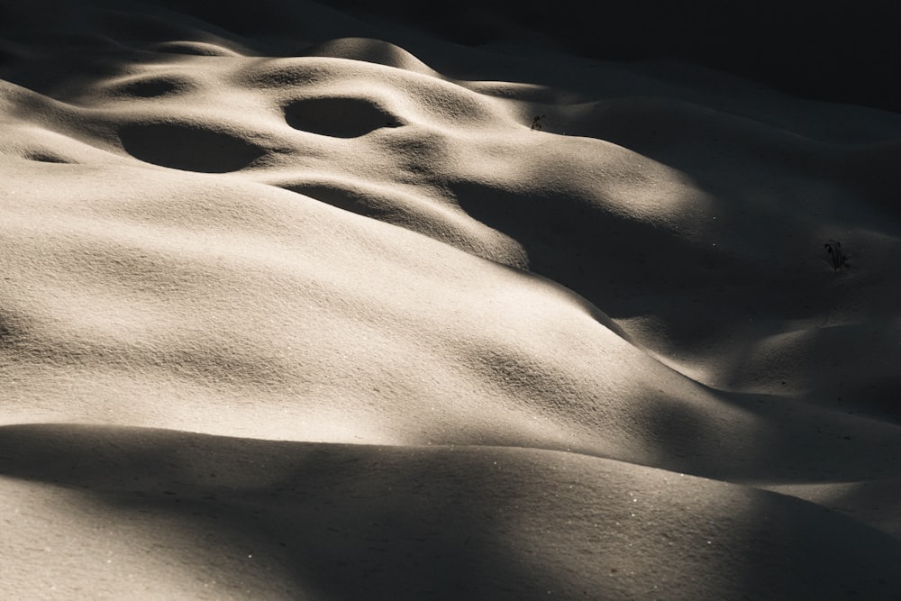 a black and white photo of snow on the ground