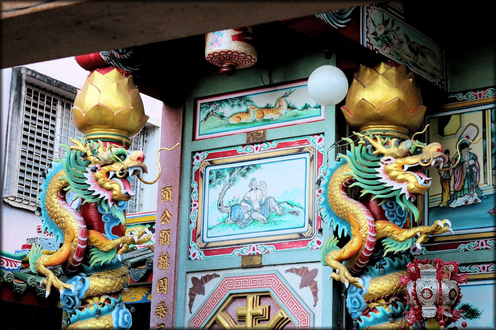 two dragon statues next to temple
