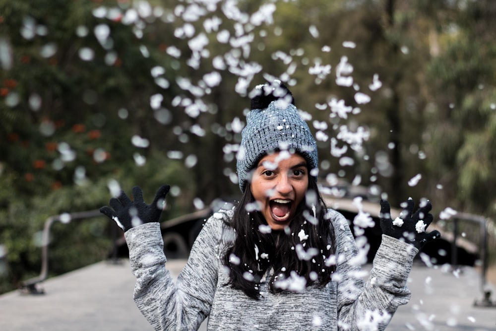 girl raising her hand outdoors