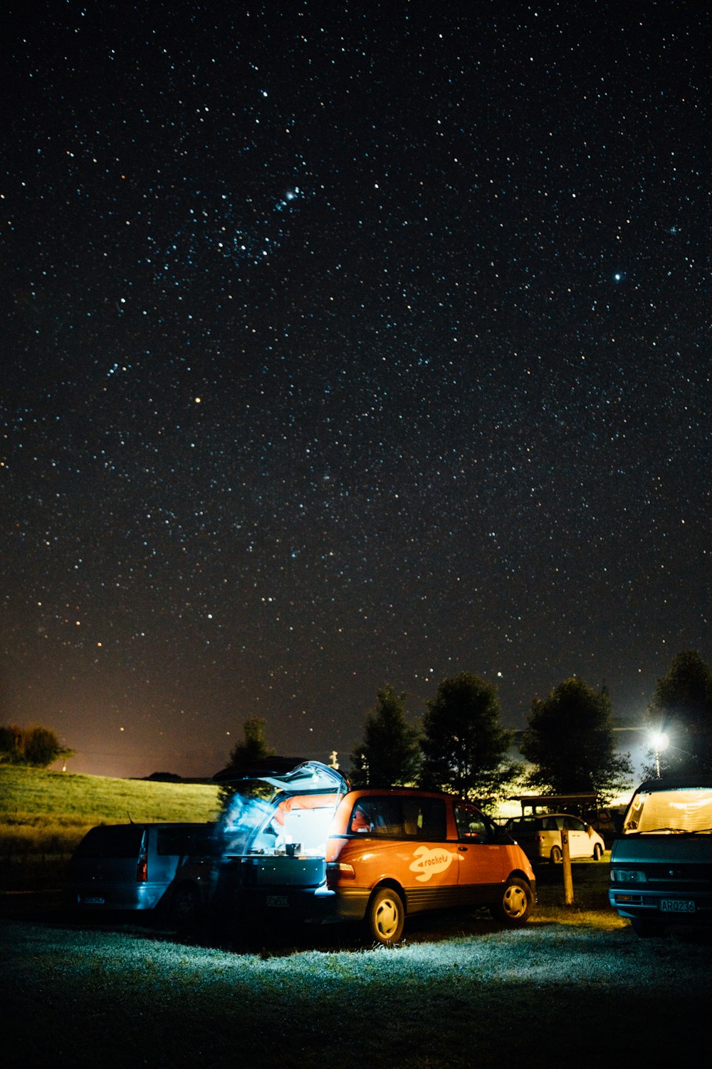 cars parked on parking lot during night time