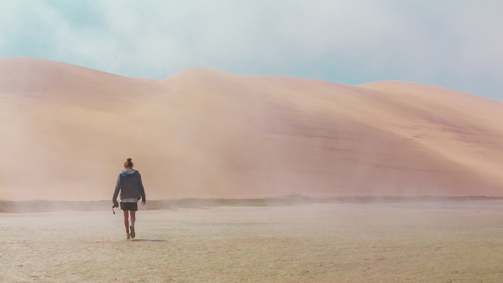 woman walking on desert