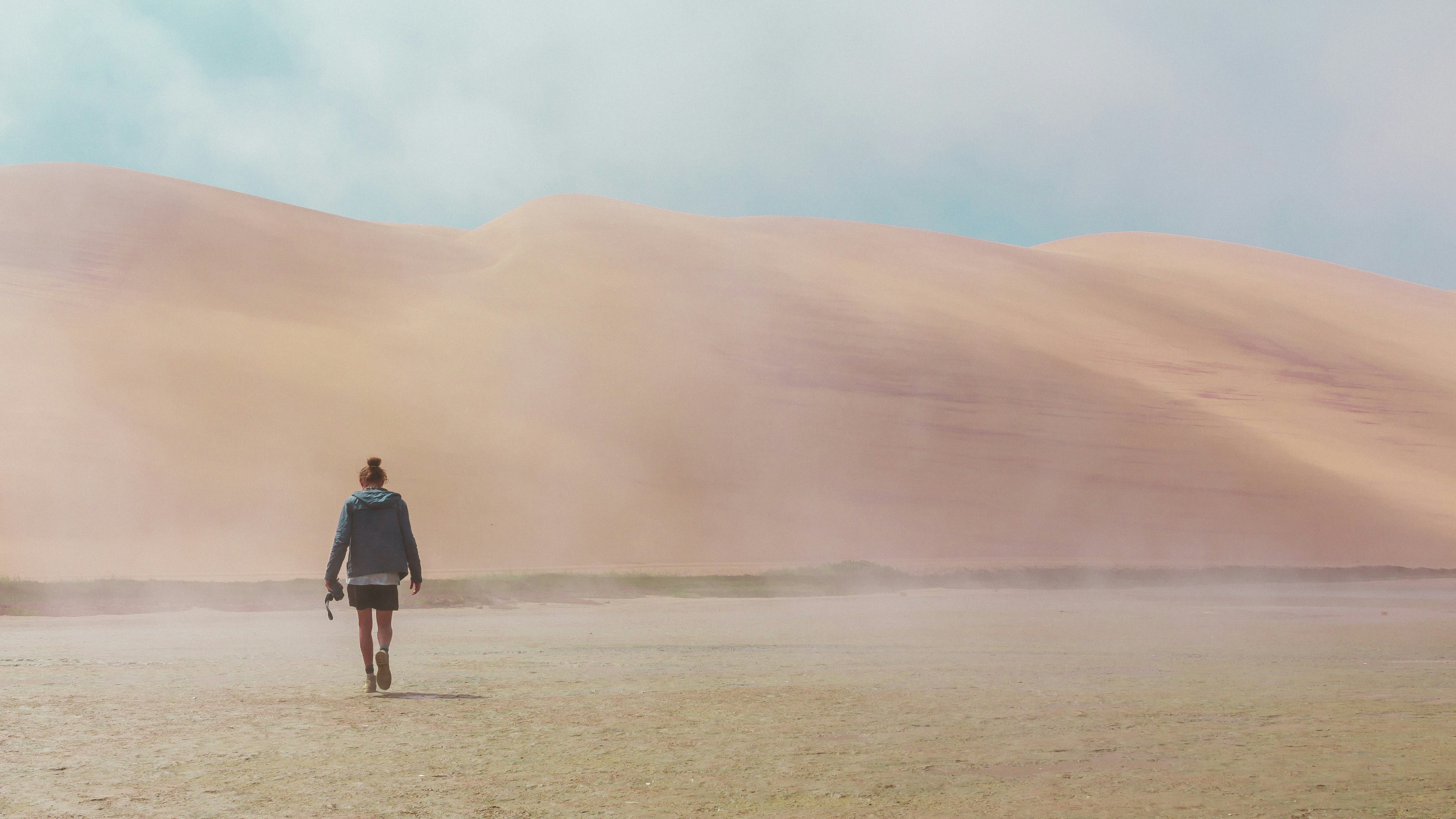 woman walking on desert