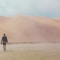 woman walking on desert