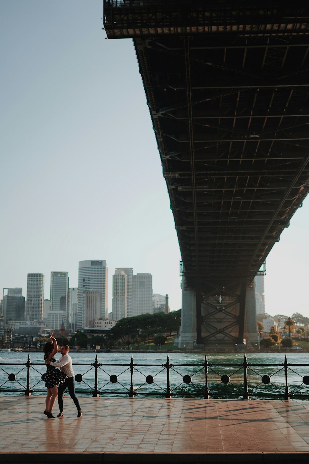 two people under bridge