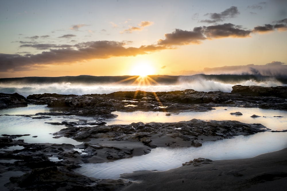 wave of water on rocks