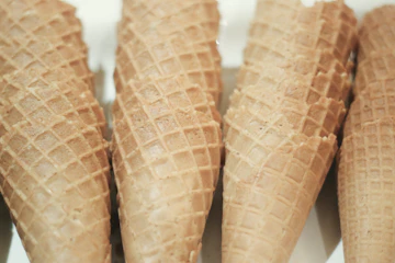 Stack of fresh golden waffle cones