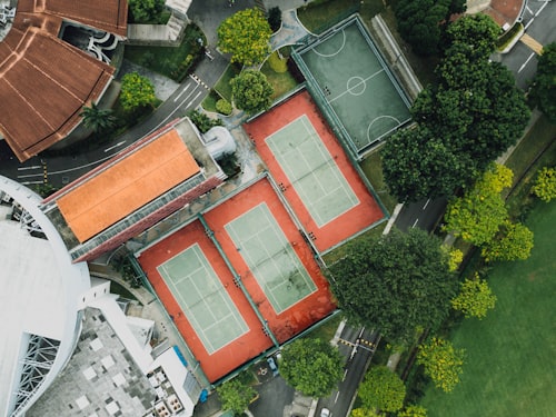 Aerial view of adjacent basketball and tennis courts