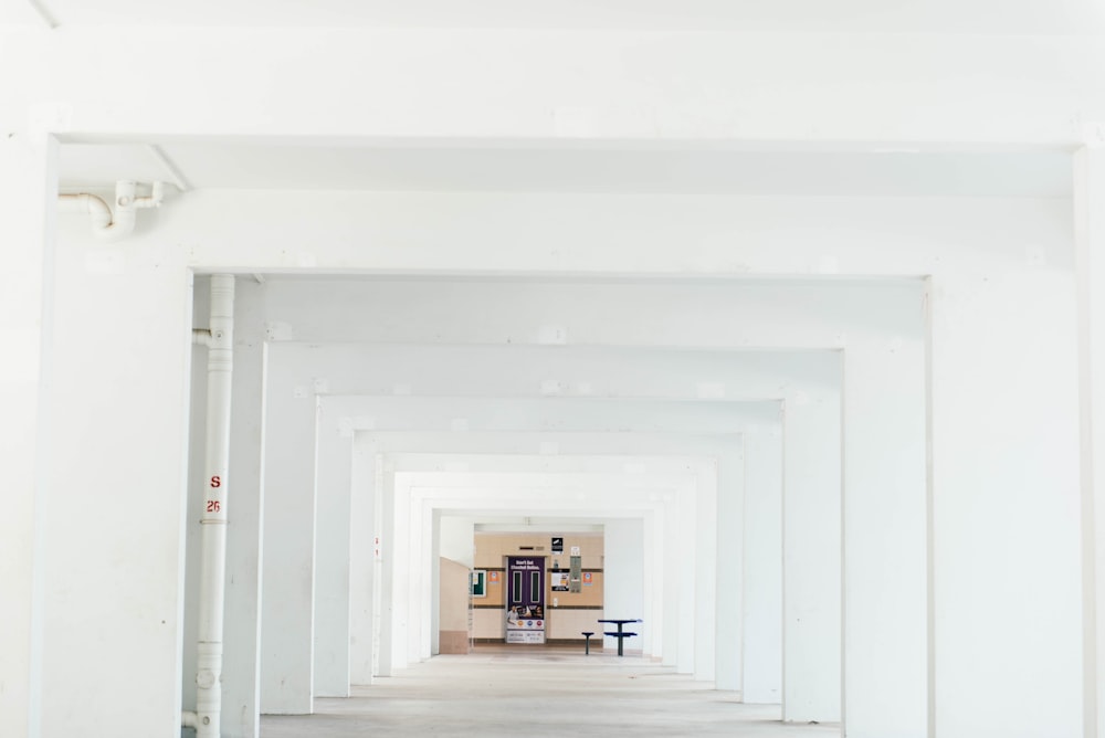 cabinet and table inside white concrete building