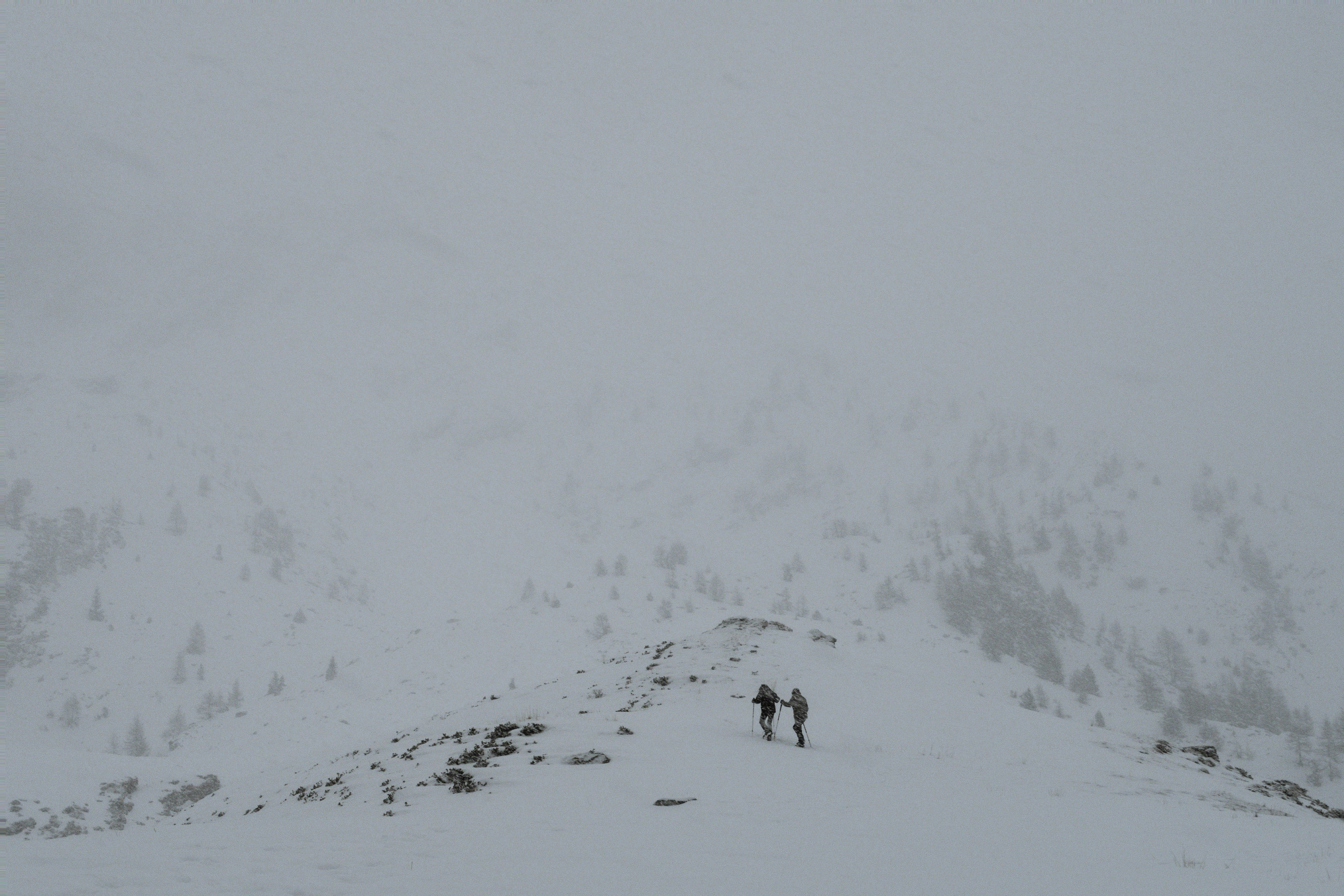 two people on mountain covered with snow