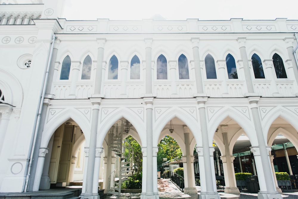 white concrete building with pillar columns